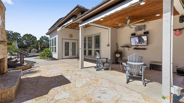 view of patio / terrace with french doors and a ceiling fan