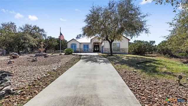 ranch-style home with stone siding