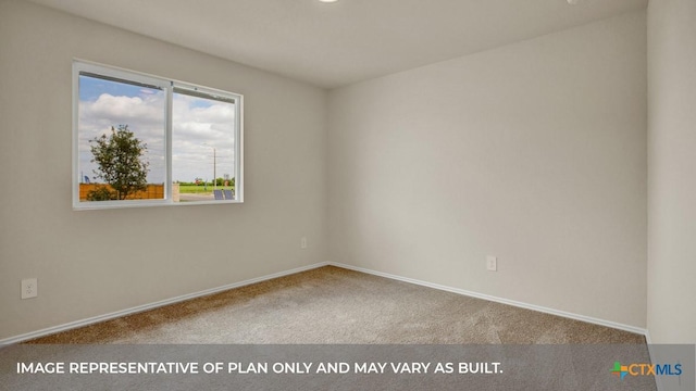 spare room with carpet flooring and baseboards