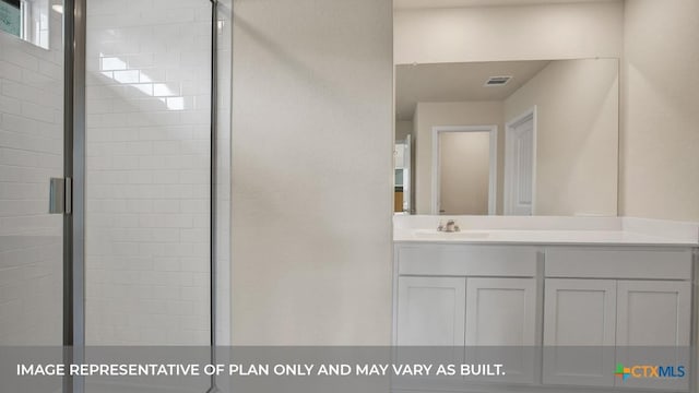 full bath featuring visible vents, a stall shower, and vanity
