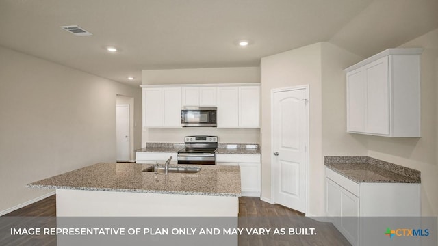 kitchen with light stone countertops, dark wood-style flooring, a sink, visible vents, and appliances with stainless steel finishes