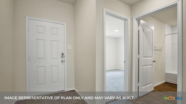 interior space with wood finished floors and baseboards