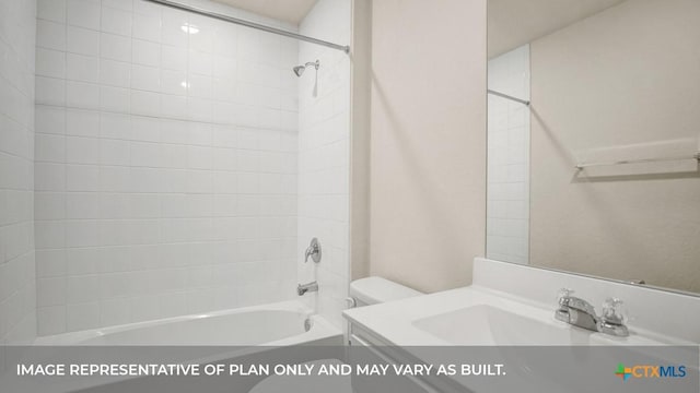bathroom featuring toilet, bathing tub / shower combination, and vanity
