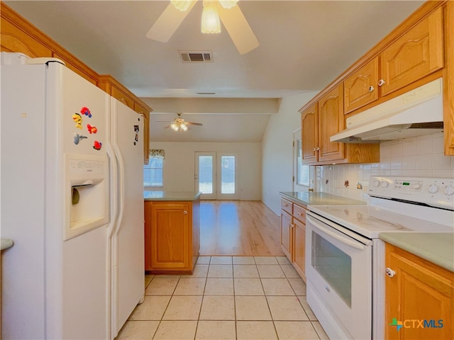 kitchen with vaulted ceiling, ceiling fan, light tile patterned flooring, backsplash, and white appliances