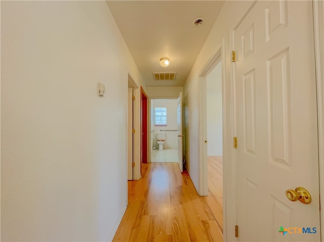 corridor featuring light wood-type flooring