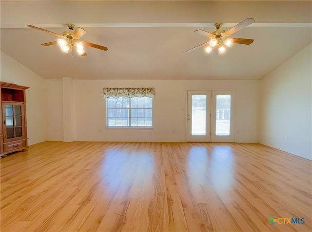 unfurnished room featuring light wood-type flooring, ceiling fan, and vaulted ceiling