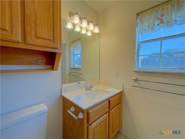 bathroom with vanity and toilet