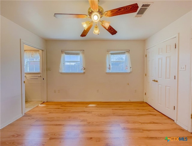 interior space featuring ceiling fan and light hardwood / wood-style flooring