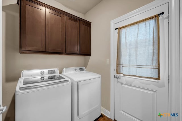 904 Central Blvd, Bertram, TX 78605 - laundry room featuring separate washer and dryer, cabinet space, and baseboards