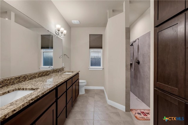 904 Central Blvd, Bertram, TX 78605 - full bath featuring double vanity, a walk in shower, and tile patterned flooring