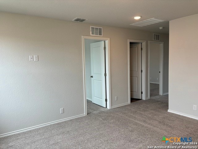 unfurnished room with light colored carpet