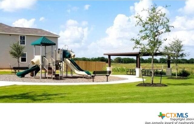 view of jungle gym featuring a yard and a gazebo