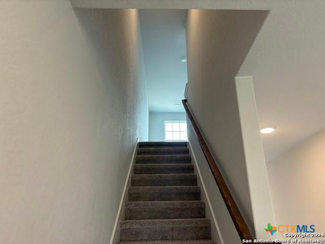 2537 Windle Ln, Seguin, TX 78155 - stairs featuring baseboards