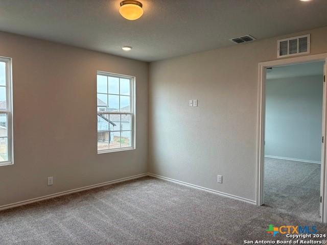 2537 Windle Ln, Seguin, TX 78155 - spare room featuring carpet flooring and baseboards