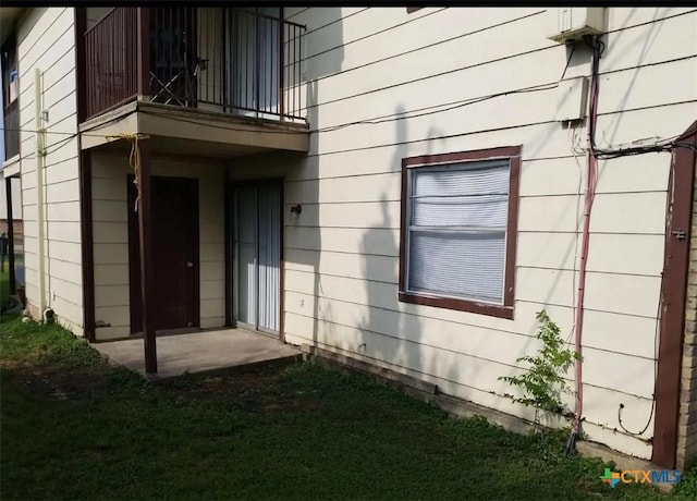 doorway to property featuring a balcony