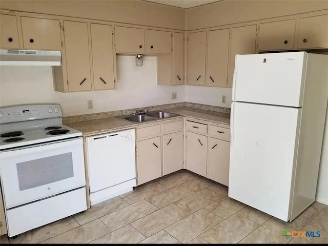 kitchen with sink and white appliances