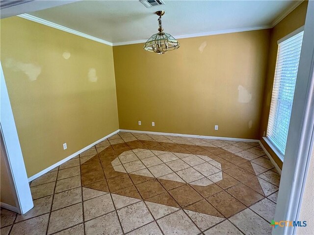unfurnished dining area featuring crown molding, baseboards, and visible vents