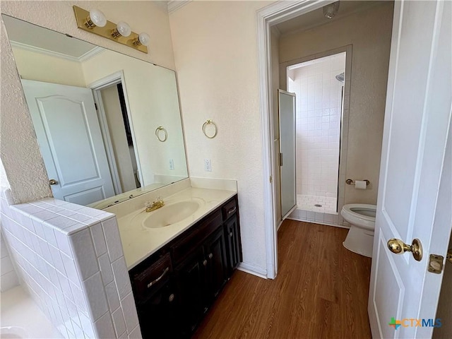 1807 Rally Ln, Harker Heights, TX 76548 - full bath with toilet, wood finished floors, a shower stall, vanity, and crown molding
