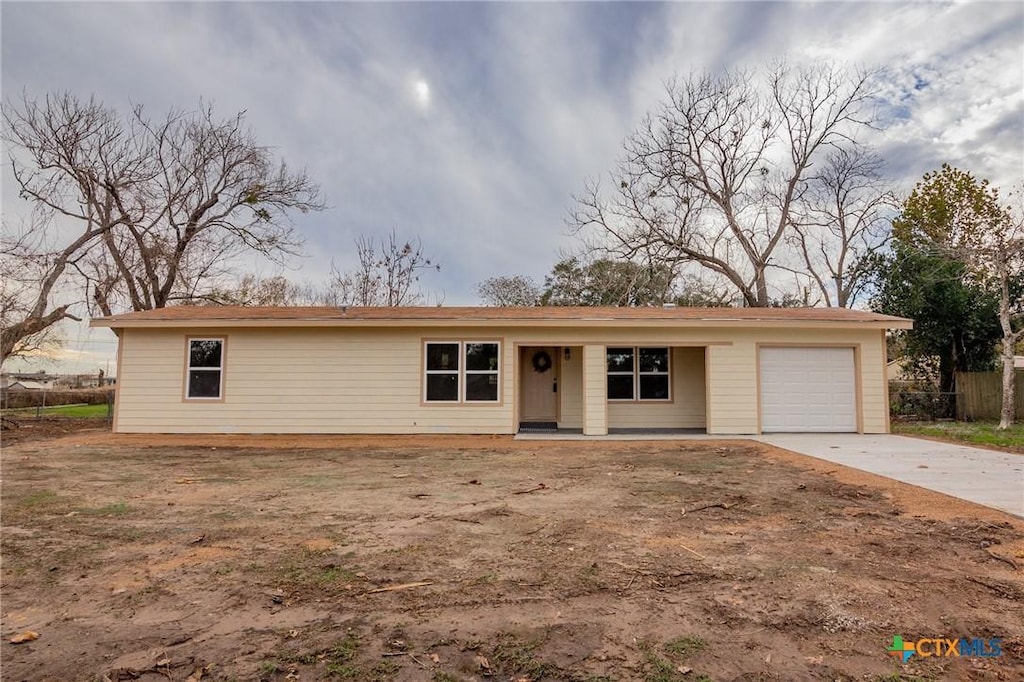 ranch-style home featuring a garage