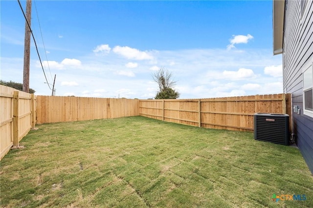 view of yard featuring a fenced backyard and cooling unit