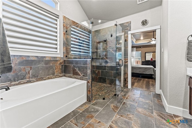 bathroom with ceiling fan and independent shower and bath