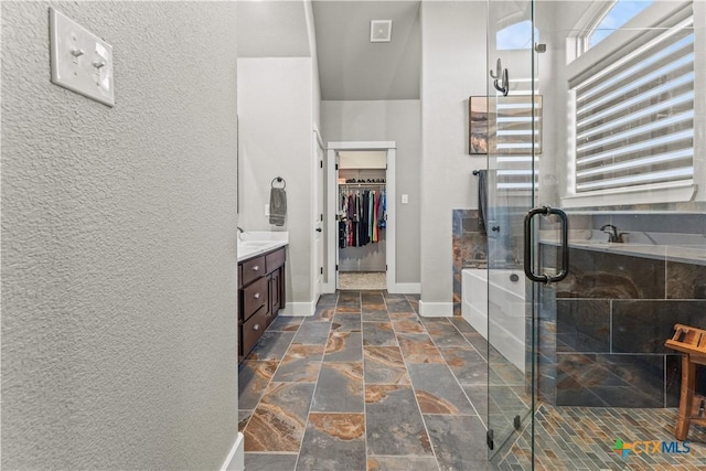 bathroom with plus walk in shower and vanity