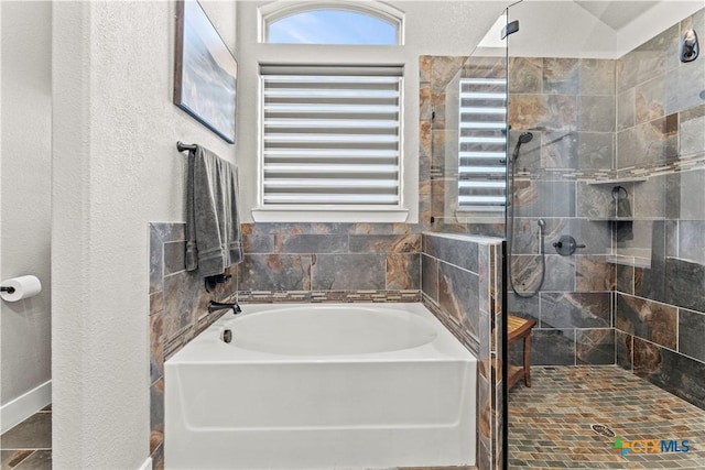 bathroom with independent shower and bath