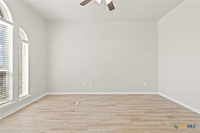 unfurnished room featuring light wood-type flooring and ceiling fan