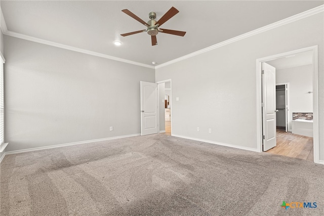 unfurnished bedroom with ornamental molding, light carpet, ceiling fan, and ensuite bath