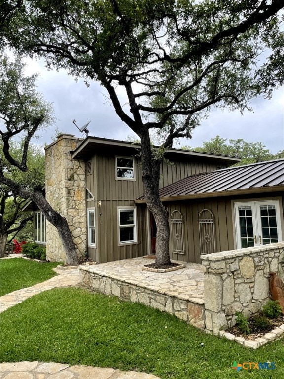 rear view of house with a lawn