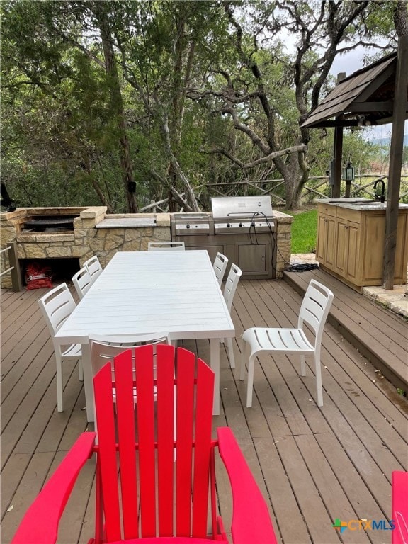 wooden deck with area for grilling