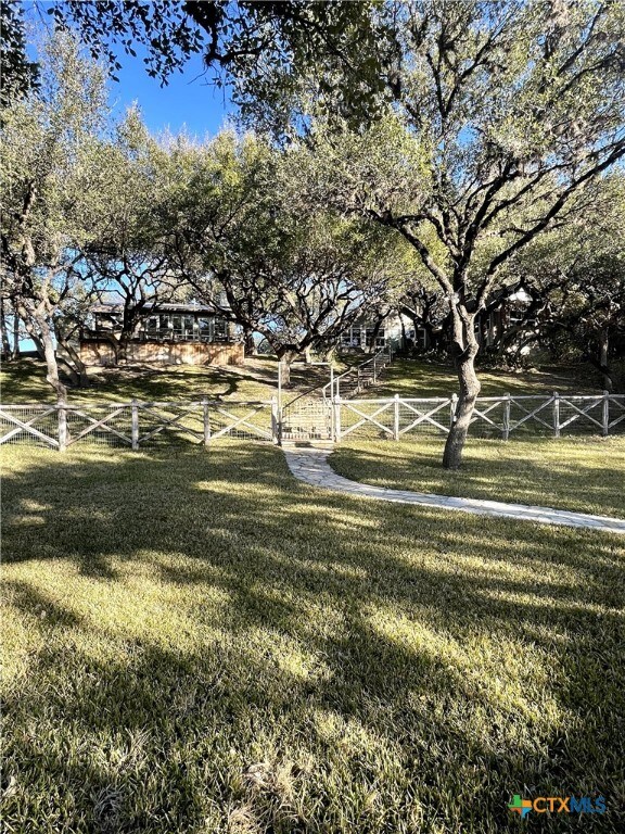 view of yard with a rural view