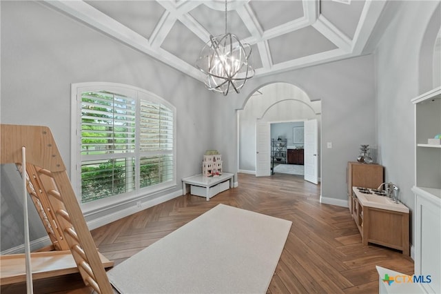 dining space with baseboards, arched walkways, coffered ceiling, and a notable chandelier