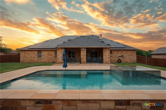 view of pool featuring a fenced backyard, a fenced in pool, an in ground hot tub, and a yard