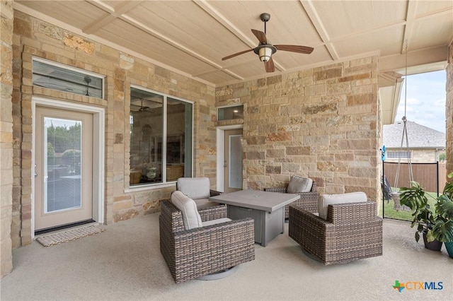 view of patio / terrace featuring ceiling fan and fence