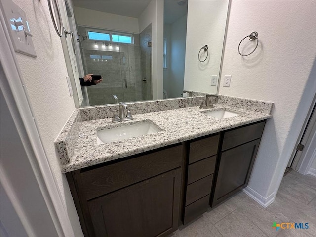 bathroom with vanity and an enclosed shower