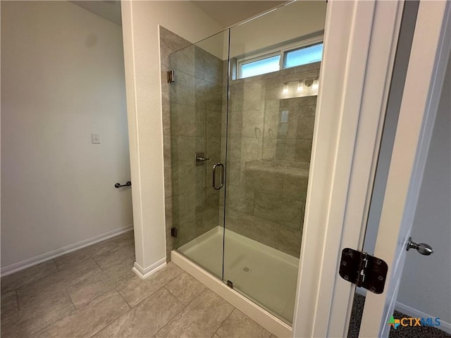 bathroom with tile patterned flooring and an enclosed shower