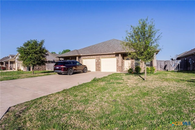 1108 Indian Mallow Dr, Temple, TX 76502 - ranch-style home featuring a front lawn, concrete driveway, fence, a garage, and brick siding