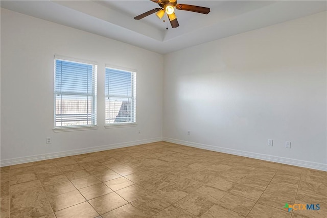 1108 Indian Mallow Dr, Temple, TX 76502 - unfurnished room with baseboards, ceiling fan, and a tray ceiling