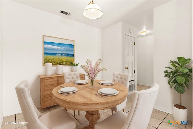 dining space with light tile patterned floors