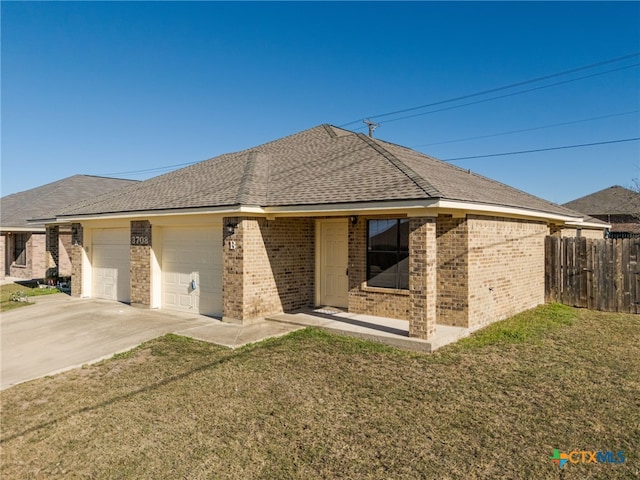 ranch-style home with a front lawn and a garage