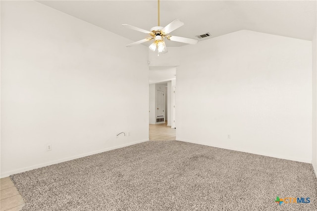 tiled spare room with ceiling fan and lofted ceiling