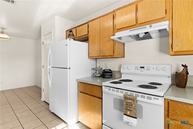 kitchen featuring light tile patterned floors and white appliances