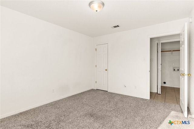 unfurnished bedroom featuring light colored carpet