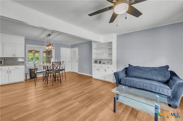 404 Oak St, Copperas Cove, TX 76522 - living room featuring light wood-type flooring and a ceiling fan