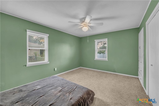 404 Oak St, Copperas Cove, TX 76522 - carpeted bedroom with baseboards and a ceiling fan