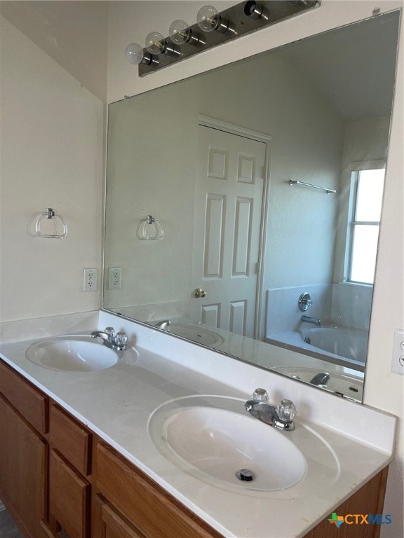 bathroom featuring vanity and a bathtub