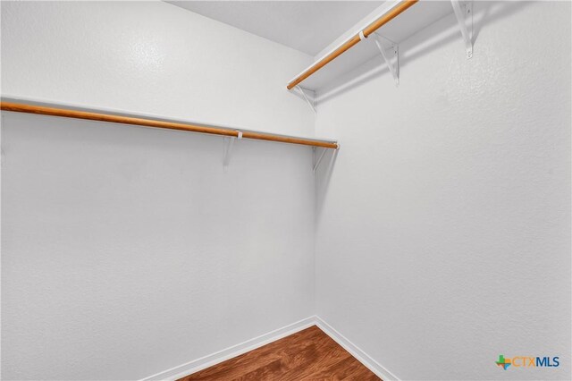 2922 Starlight Dr, Copperas Cove, TX 76522 - spacious closet featuring dark wood-style floors