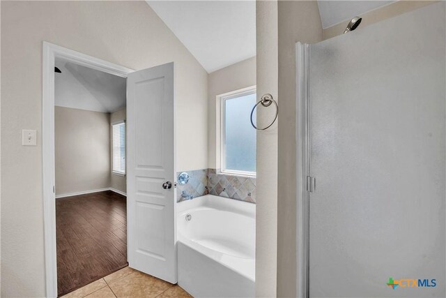 2922 Starlight Dr, Copperas Cove, TX 76522 - full bath featuring a shower stall, a bath, lofted ceiling, and tile patterned flooring
