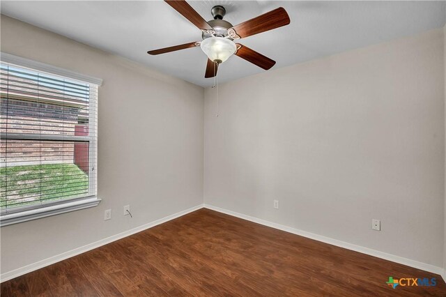 2922 Starlight Dr, Copperas Cove, TX 76522 - spare room with dark wood-style floors, baseboards, and a ceiling fan